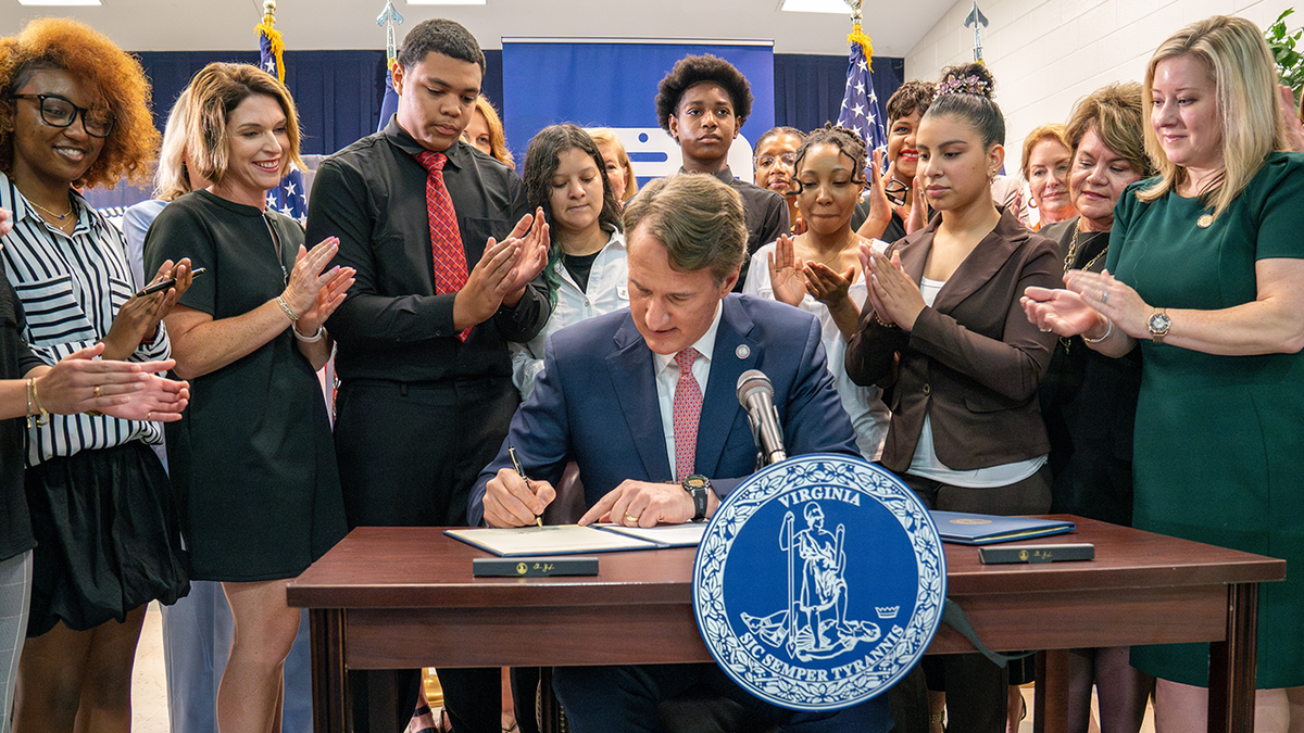Governor Glenn Youngkin signs a bill on the law that limits the use of mobile phone in Virginia public schools.